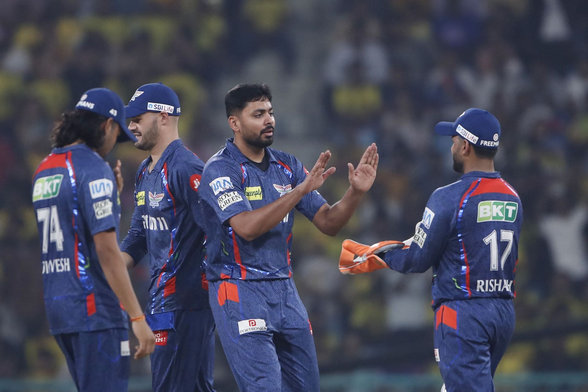 Avesh Khan celebrates picking a wicket with his teammates- Source: Getty